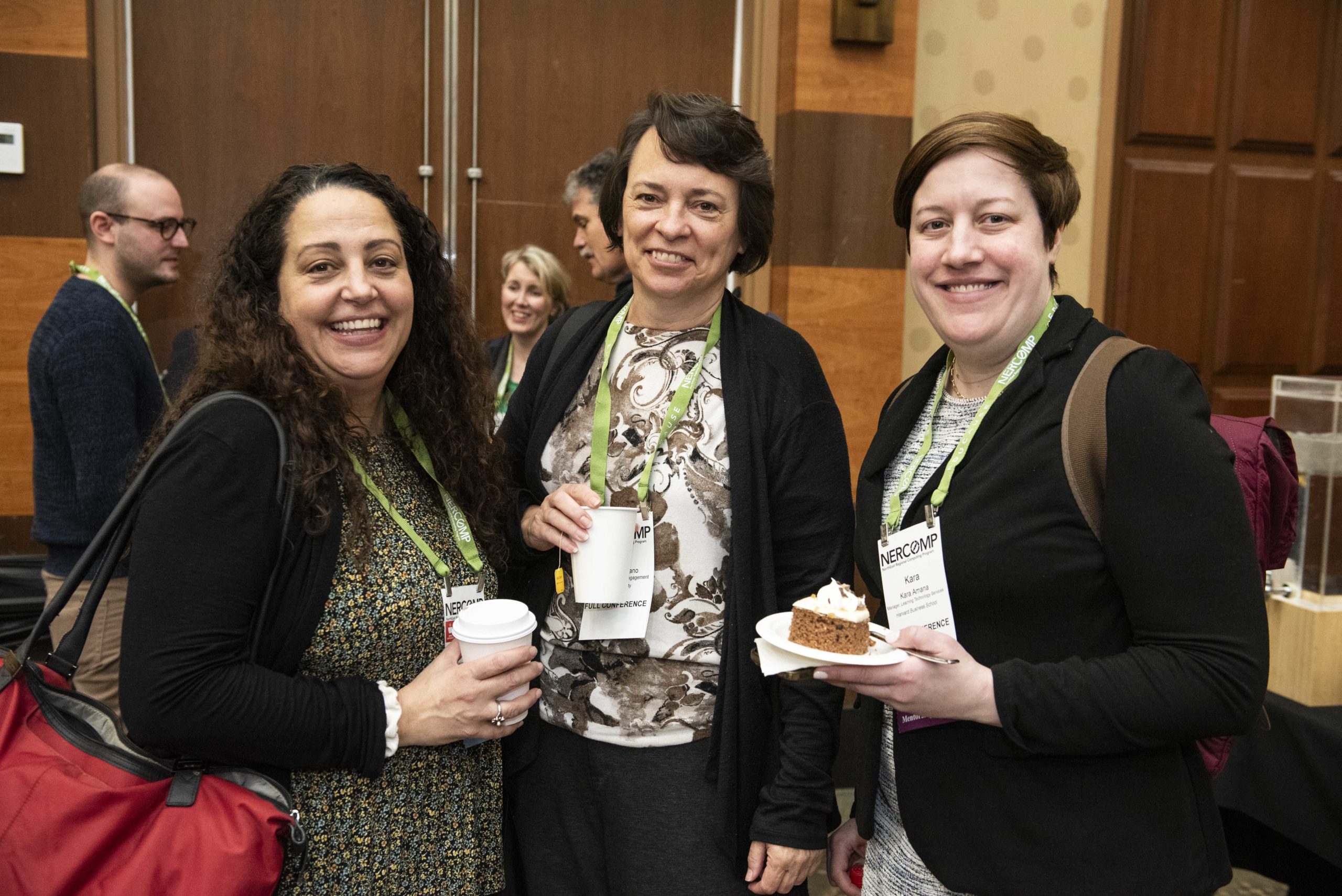 three women standing at the conference